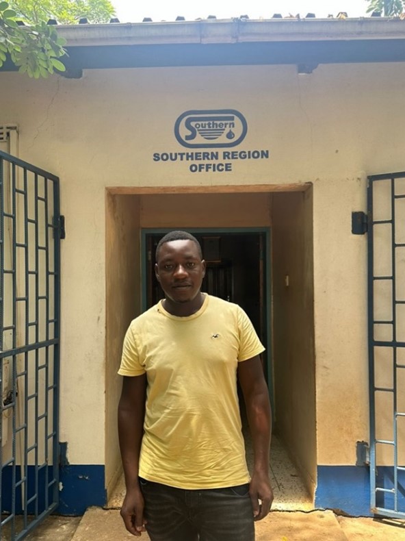 Leo, formalized emptier from Livingstone, Zambia in front of the utility (Southern Water and Sanitation Company) office Source:FSG Leo, formalized emptier from Livingstone, Zambia in front of the utility (Southern Water and Sanitation Company) office Source:FSG